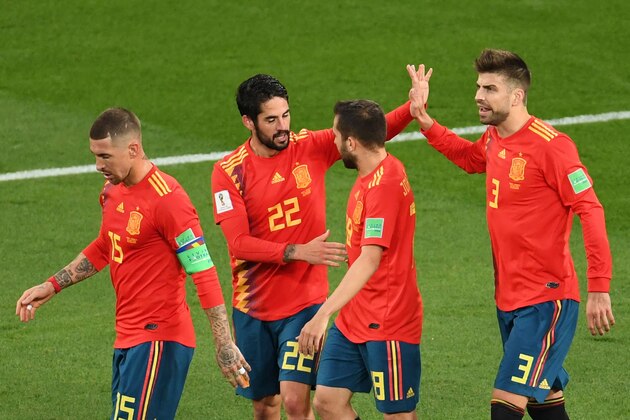 TOPSHOT - Spain's midfielder Isco (2ndL) celebrates with (fromL) Spain's defender Sergio Ramos, Spain's defender Jordi Alba and Spain's defender Gerard Pique after scoring their first goal during the Russia 2018 World Cup Group B football match between Spain and Morocco at the Kaliningrad Stadium in Kaliningrad on June 25, 2018. (Photo by OZAN KOSE / AFP) / RESTRICTED TO EDITORIAL USE - NO MOBILE PUSH ALERTS/DOWNLOADS        (Photo credit should read OZAN KOSE/AFP/Getty Images)