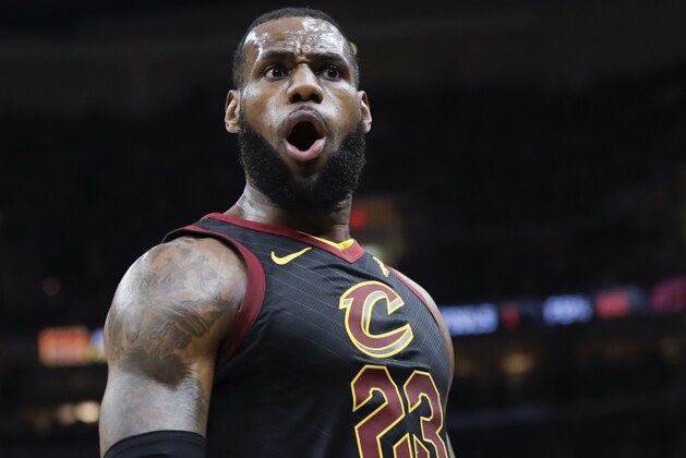 Cleveland Cavaliers' LeBron James (23) reacts after dunking against the Toronto Raptors in the first half of Game 3 of an NBA basketball second-round playoff series, Saturday, May 5, 2018, in Cleveland. (AP Photo/Tony Dejak)