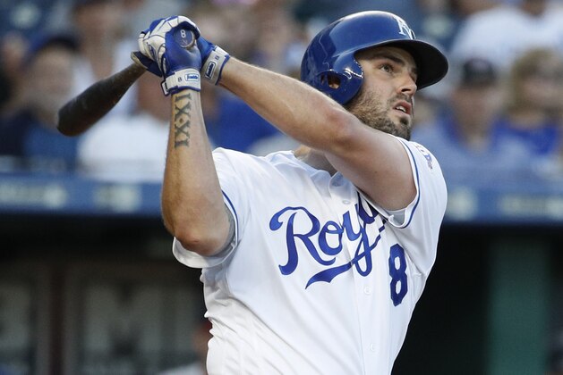 Kansas City Royals' Mike Moustakas watches his two-run home run against the Minnesota Twins during the second inning of a baseball game Wednesday, May 30, 2018, in Kansas City, Mo. (AP Photo/Charlie Riedel)