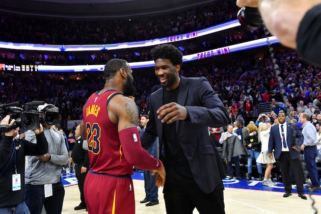 PHILADELPHIA, PA - APRIL 6:  LeBron James #23 of the Cleveland Cavaliers exchanges a hug with Joel Embiid #21 of the Philadelphia 76ers after the game between the two teams on April 6, 2018 in Philadelphia, Pennsylvania NOTE TO USER: User expressly acknowledges and agrees that, by downloading and/or using this Photograph, user is consenting to the terms and conditions of the Getty Images License Agreement. Mandatory Copyright Notice: Copyright 2018 NBAE (Photo by Jesse D. Garrabrant/NBAE via Getty Images)