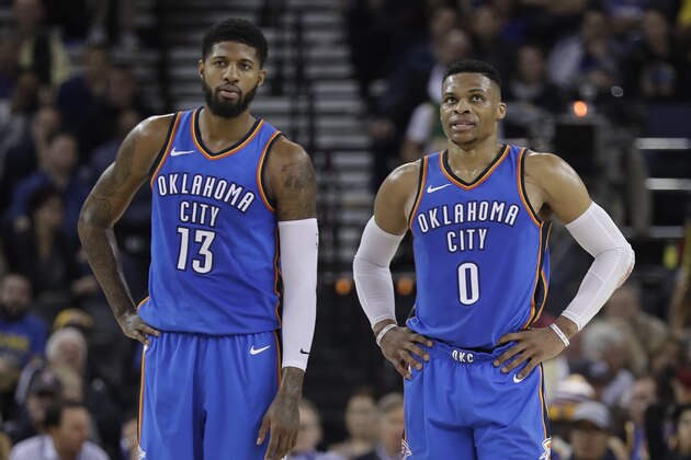 Oklahoma City Thunder's Russell Westbrook (0) stands next to teammate Paul George (13) during the first half of an NBA basketball game against the Golden State Warriors Tuesday, Feb. 6, 2018, in Oakland, Calif. (AP Photo/Marcio Jose Sanchez) Oklahoma City Thunder's Russell Westbrook (0) stands next to teammate Paul George (13) during the first half of an NBA basketball game against the Golden State Warriors Tuesday, Feb. 6, 2018, in Oakland, Calif. (AP Photo/Marcio Jose Sanchez)