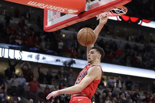 Chicago Bulls' Zach LaVine dunks the ball after stealing a pass intended for Orlando Magic's Shelvin Mack during the second half of an NBA basketball game Monday, Feb. 12, 2018, in Chicago. Bulls won 105-101. (AP Photo/Charles Rex Arbogast)