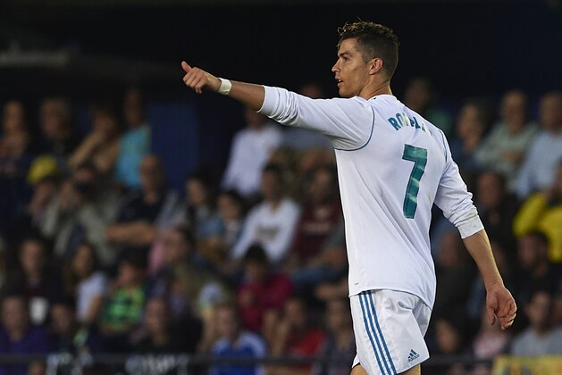 VILLARREAL, SPAIN - MAY 19:  Cristiano Ronaldo of Real Madrid celebrates after scoring his sides second goal during the La Liga match between Villarreal and Real Madrid at Estadio de La Ceramica on May 19, 2018 in Villarreal, Spain.  (Photo by Manuel Queimadelos Alonso/Getty Images)