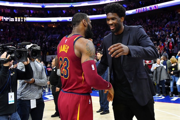 PHILADELPHIA, PA - APRIL 6:  LeBron James #23 of the Cleveland Cavaliers exchanges a hug with Joel Embiid #21 of the Philadelphia 76ers after the game between the two teams on April 6, 2018 in Philadelphia, Pennsylvania NOTE TO USER: User expressly acknowledges and agrees that, by downloading and/or using this Photograph, user is consenting to the terms and conditions of the Getty Images License Agreement. Mandatory Copyright Notice: Copyright 2018 NBAE (Photo by Jesse D. Garrabrant/NBAE via Getty Images)