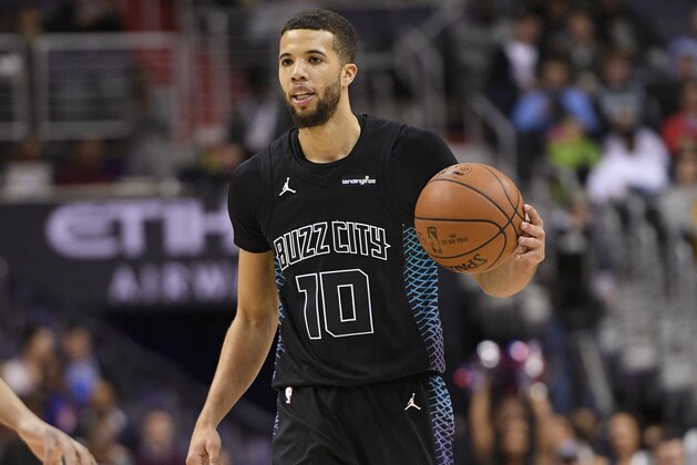 Charlotte Hornets guard Michael Carter-Williams (10) dribbles the ball during the first half of an NBA basketball game against the Washington Wizards, Friday, Feb. 23, 2018, in Washington. (AP Photo/Nick Wass)