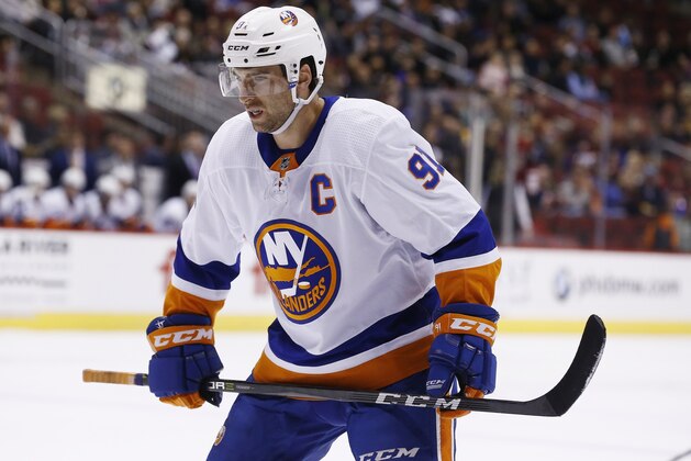 New York Islanders center John Tavares (91) pauses on the ice during the first period of an NHL hockey game against the Arizona Coyotes, Monday, Jan. 22, 2018, in Glendale, Ariz. The Coyotes defeated the Islanders 3-2 in overtime. (AP Photo/Ross D. Franklin)