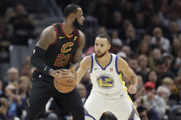 Cleveland Cavaliers' LeBron James is defended by Golden State Warriors' Stephen Curry in the first half of Game 3 of basketball's NBA Finals, Wednesday, June 6, 2018, in Cleveland. (AP Photo/Tony Dejak)