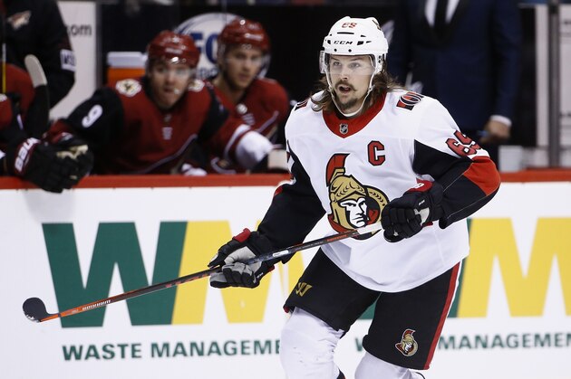 Ottawa Senators defenseman Erik Karlsson (65) skates to the puck during the first period of an NHL hockey game against the Arizona Coyotes Saturday, March 3, 2018, in Glendale, Ariz. The Coyotes defeated the Senators 2-1. (AP Photo/Ross D. Franklin)