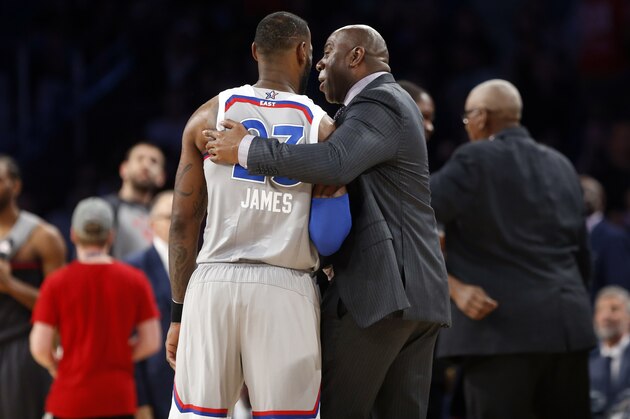 Former NBA player Magic Johnson laughs with Eastern Conference LeBron James of the Cleveland Caveliers (23) during the first half of the NBA All-Star basketball game in New Orleans, Sunday, Feb. 19, 2017. (AP Photo/Gerald Herbert)