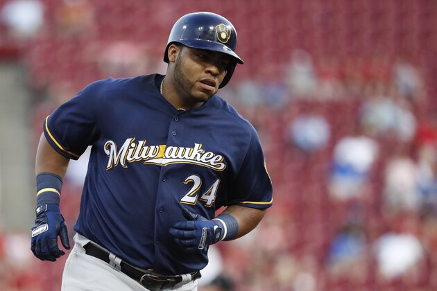 Milwaukee Brewers' Jesus Aguilar runs the bases after hitting a two-run home run off Cincinnati Reds starting pitcher Anthony DeSclafani in the third inning of a baseball game, Thursday, June 28, 2018, in Cincinnati. (AP Photo/John Minchillo)