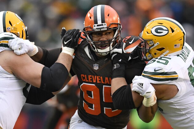 Cleveland Browns defensive end Myles Garrett, center, squeezes between Green Bay Packers offensive tackle David Bakhtiari, left, and offensive guard Lane Taylor in the second half of an NFL football game, Sunday, Dec. 10, 2017, in Cleveland. The Packers won 27-21 in overtime. (AP Photo/David Richard)