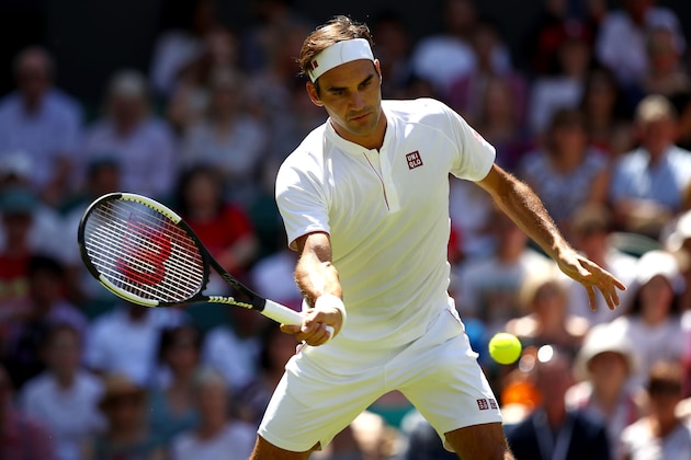 LONDON, ENGLAND - JULY 02:  Roger Federer of Switzerland returns to Dusan Lajovic of Serbia during their Men's Singles first round match on day one of the Wimbledon Lawn Tennis Championships at All England Lawn Tennis and Croquet Club on July 2, 2018 in London, England.  (Photo by Clive Brunskill/Getty Images)