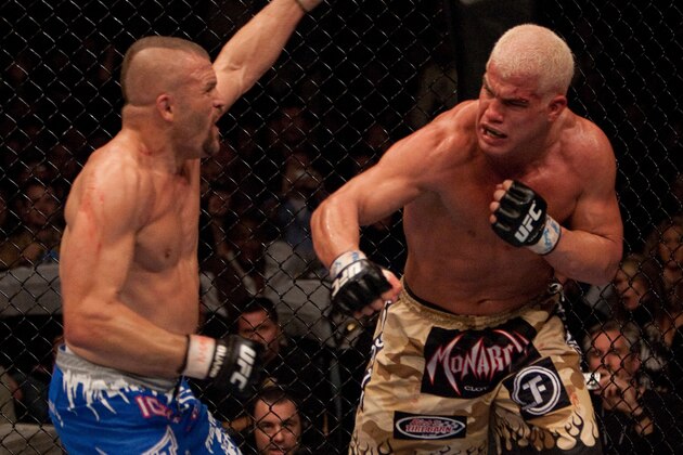 LAS VEGAS - DECEMBER 30:  (R-L) Tito Ortiz punches Chuck Liddell at  UFC 66 at the MGM Grand Garden Arena on December 30, 2006 in Las Vegas, Nevada.  (Photo by Josh Hedges/Zuffa LLC/Zuffa LLC via Getty Images)