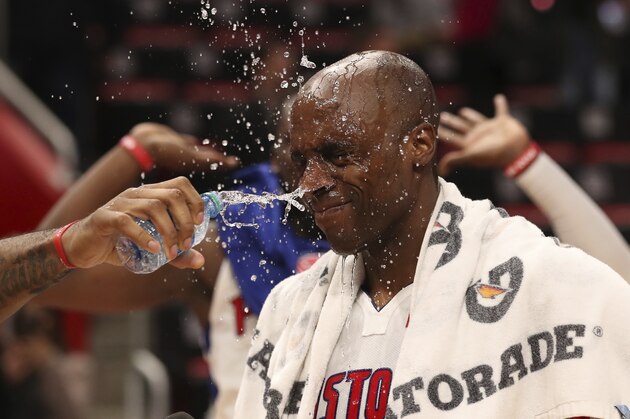 Detroit Pistons center Andre Drummond and guard Reggie Jackson pour water on forward Anthony Tolliver as Tolliver is interviewed after the second half of an NBA basketball game against the Chicago Bulls, Saturday, March 24, 2018, in Detroit. (AP Photo/Carlos Osorio)