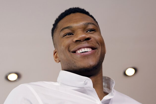 NBA star Giannis Antetokounmpo, smiles during a press conference by Greece's Tourism Ministry to promote his native Greece, in Athens, on Friday, June 29, 2018. Antetokounmpo, whose parents immigrated to Greece from Nigeria, said he always encourages his friends to visit but his favorite part of the country is Athens, where he grew up. (AP Photo/Petros Giannakouris)