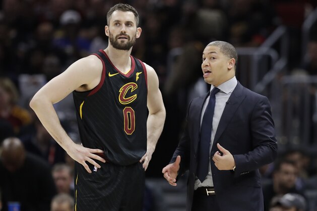Cleveland Cavaliers coach Tyronn Lue talks with Kevin Love during the second half in Game 4 against the Golden State Warriors in basketball's NBA Finals, Friday, June 8, 2018, in Cleveland. (AP Photo/Tony Dejak)