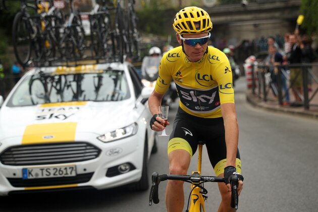 PARIS, FRANCE - JULY 23:  Christopher Froome of Great Britain riding for Team Sky in the yellow leader's jersey celebrates his fourth General Classification overall victory with champagne during stage 21 of the 2017 Le Tour de France, a 103km stage from Montgreon to the Paris Champs-Élysées on July 23, 2017 in Paris, France.  (Photo by Chris Graythen/Getty Images)