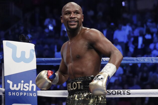 Floyd Mayweather Jr. fights Conor McGregor in a super welterweight boxing match Saturday, Aug. 26, 2017, in Las Vegas. (AP Photo/Isaac Brekken)