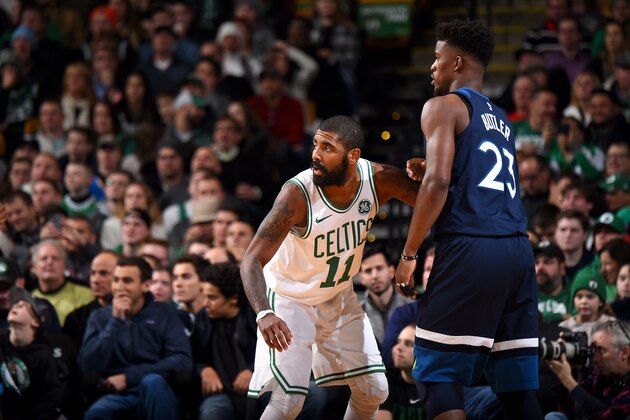 BOSTON, MA - JANUARY 5: Kyrie Irving #11 of the Boston Celtics on defense against Jimmy Butler #23 of the Minnesota Timberwolves on January 5, 2018 at the TD Garden in Boston, Massachusetts. NOTE TO USER: User expressly acknowledges and agrees that, by downloading and or using this photograph, User is consenting to the terms and conditions of the Getty Images License Agreement. Mandatory Copyright Notice: Copyright 2018 NBAE (Photo by Brian Babineau/NBAE via Getty Images)