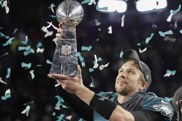Philadelphia Eagles' Nick Foles holds up the Vince Lombardi Trophy after the NFL Super Bowl 52 football game against the New England Patriots Sunday, Feb. 4, 2018, in Minneapolis. The Eagles won 41-33. (AP Photo/Matt Slocum)