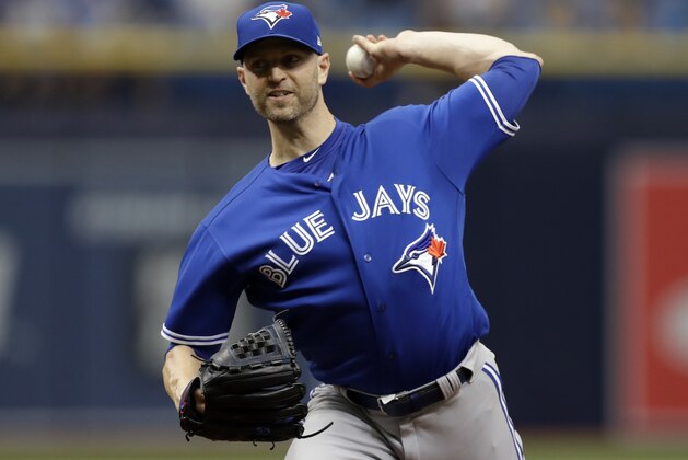 Toronto Blue Jays' J.A. Happ pitches to the Tampa Bay Rays during the first inning of a baseball game Wednesday, June 13, 2018, in St. Petersburg, Fla. (AP Photo/Chris O'Meara)