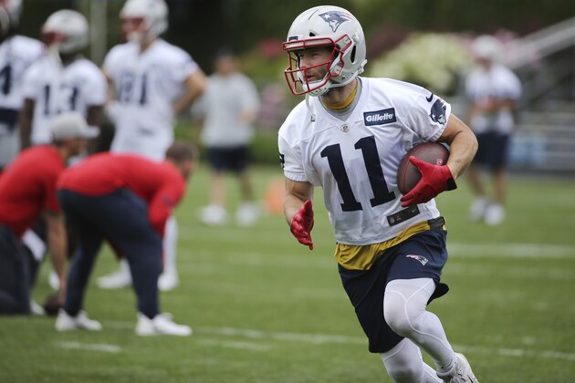 New England Patriots wide receiver Julian Edelman (11) runs with the ball during an NFL football minicamp practice, Wednesday, June 6, 2018, in Foxborough, Mass. (AP Photo/Elise Amendola)