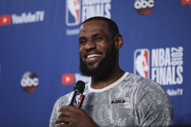 Cleveland Cavaliers forward LeBron James takes questions at a press conference after the basketball team's practiced during the NBA Finals, Thursday, June 7, 2018, in Cleveland. The Warriors lead the series 3-0 with Game 4 on Friday. (AP Photo/Carlos Osorio)