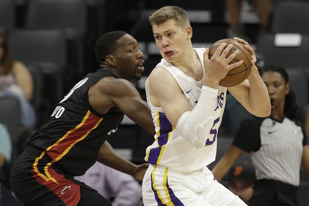 Miami Heat center Bam Adebayo, left, guards Los Angeles Lakers center Moritz Wagner during the first half of an NBA summer league basketball game Tuesday, July 3, 2018, in Sacramento, Calif. (AP Photo/Rich Pedroncelli)