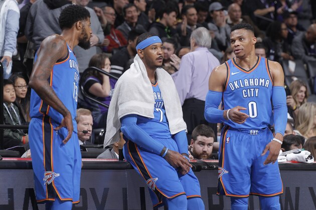 SACRAMENTO, CA - FEBRUARY 22: Paul George #13, Carmelo Anthony #7 and Russell Westbrook #0 of the Oklahoma City Thunder talk during the game against the Sacramento Kings on February 22, 2018 at Golden 1 Center in Sacramento, California. NOTE TO USER: User expressly acknowledges and agrees that, by downloading and or using this photograph, User is consenting to the terms and conditions of the Getty Images Agreement. Mandatory Copyright Notice: Copyright 2018 NBAE (Photo by Rocky Widner/NBAE via Getty Images)