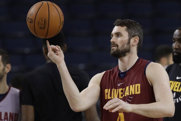 Cleveland Cavaliers' Kevin Love juggles a basketball during an NBA basketball practice, Wednesday, May 30, 2018, in Oakland, Calif. The Cavaliers face the Golden State Warriors in Game 1 of the NBA Finals on Thursday in Oakland. (AP Photo/Marcio Jose Sanchez)