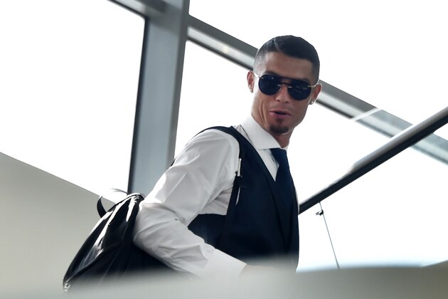 Portugal's forward Cristiano Ronaldo arrives at the Zhukovsky airport, about 40 km southeast of Moscow, on July 1, 2018, as Portugal's team departs following their loss the previous day to Uruguay in their Russia 2018 World Cup round of 16 football match. (Photo by Vasily MAXIMOV / AFP)        (Photo credit should read VASILY MAXIMOV/AFP/Getty Images)