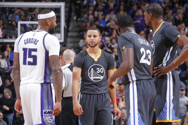 SACRAMENTO, CA - FEBRUARY 4: Stephen Curry #30, Draymond Green #23 and Kevin Durant #35 of the Golden State Warriors face off against DeMarcus Cousins #15 of the Sacramento Kings on February 4, 2017 at Golden 1 Center in Sacramento, California. NOTE TO USER: User expressly acknowledges and agrees that, by downloading and or using this photograph, User is consenting to the terms and conditions of the Getty Images Agreement. Mandatory Copyright Notice: Copyright 2017 NBAE (Photo by Rocky Widner/NBAE via Getty Images)
