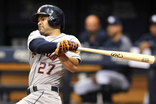 Houston Astros' Jose Altuve hits a single off Tampa Bay Rays starter Ryne Stanek during the first inning of a baseball game Saturday, June 30, 2018, in St. Petersburg, Fla. (AP Photo/Steve Nesius)