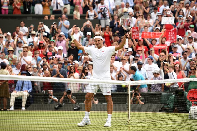 Switzerland's Roger Federer reacts after winning against Slovakia's Lukas Lacko during their men's singles second round match on the third day of the 2018 Wimbledon Championships at The All England Lawn Tennis Club in Wimbledon, southwest London, on July 4, 2018. - Federer won the match 6-4, 6-4, 6-1. (Photo by Oli SCARFF / AFP) / RESTRICTED TO EDITORIAL USE        (Photo credit should read OLI SCARFF/AFP/Getty Images)