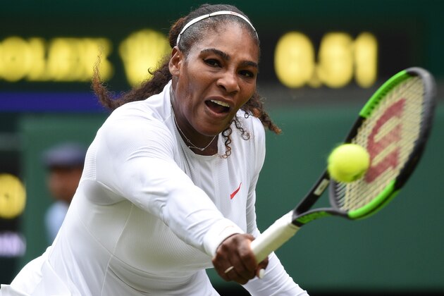 US player Serena Williams returns against Bulgaria's Viktoriya Tomova during their women's singles second round match on the third day of the 2018 Wimbledon Championships at The All England Lawn Tennis Club in Wimbledon, southwest London, on July 4, 2018. - Williams won the match 6-1, 6-4. (Photo by Oli SCARFF / AFP) / RESTRICTED TO EDITORIAL USE        (Photo credit should read OLI SCARFF/AFP/Getty Images)