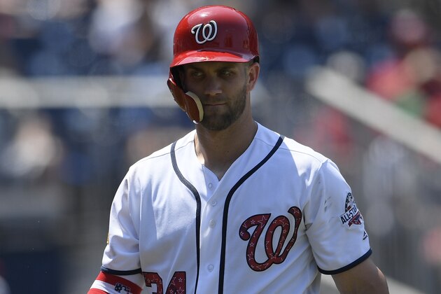 Washington Nationals' Bryce Harper walks back to the dugout after he struck out during the ninth inning of a baseball game against the Boston Red Sox, Wednesday, July 4, 2018, in Washington. The Red Sox won 3-0.(AP Photo/Nick Wass)