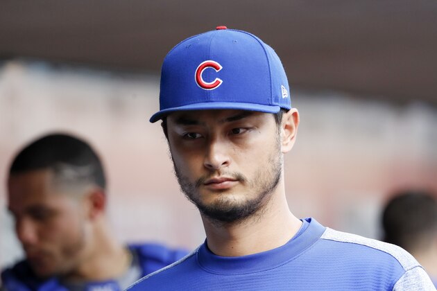 Chicago Cubs starting pitcher Yu Darvish walks through the dugout in the eighth inning of a baseball game against the Cincinnati Reds, Saturday, June 23, 2018, in Cincinnati. (AP Photo/John Minchillo)