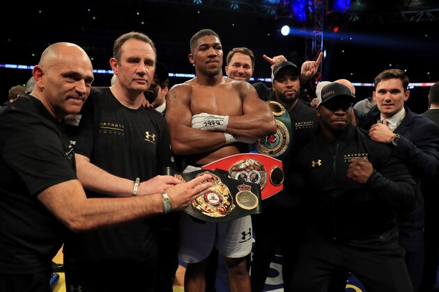 LONDON, ENGLAND - APRIL 29:  Anthony Joshua celebrates victory with his team after the IBF, WBA and IBO Heavyweight World Title bout at Wembley Stadium on April 29, 2017 in London, England.  (Photo by Richard Heathcote/Getty Images)