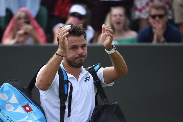 Switzerland's Stan Wawrinka waves after losing to Italy's Thomas Fabbiano in their men's singles second round match on the fourth day of the 2018 Wimbledon Championships at The All England Lawn Tennis Club in Wimbledon, southwest London, on July 5, 2018. (Photo by Oli SCARFF / AFP) / RESTRICTED TO EDITORIAL USE        (Photo credit should read OLI SCARFF/AFP/Getty Images)