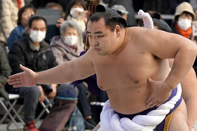 Sumo grand champion Kakuryu of Mongolia performs his ring entry form at the Meiji Shrine in Tokyo, Tuesday, Jan. 9, 2018. The Shinto ritual is part of the annual New Year's celebrations at the shrine. (AP Photo/Shizuo Kambayashi)