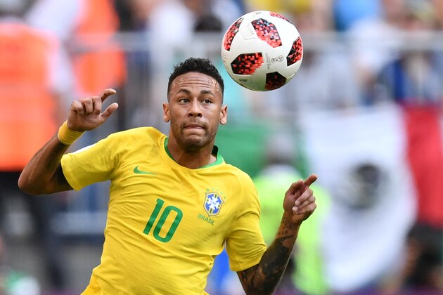 TOPSHOT - Brazil's forward Neymar eyes the ball during the Russia 2018 World Cup round of 16 football match between Brazil and Mexico at the Samara Arena in Samara on July 2, 2018. (Photo by Fabrice COFFRINI / AFP) / RESTRICTED TO EDITORIAL USE - NO MOBILE PUSH ALERTS/DOWNLOADS        (Photo credit should read FABRICE COFFRINI/AFP/Getty Images)