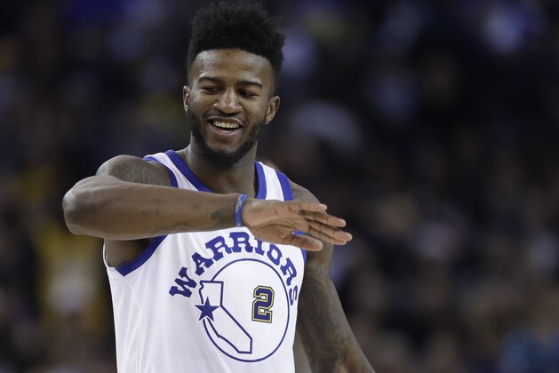Golden State Warriors forward Jordan Bell (2) reacts after scoring against the Los Angeles Lakers during the first half of an NBA basketball game Friday, Dec. 22, 2017, in Oakland, Calif. (AP Photo/Marcio Jose Sanchez)