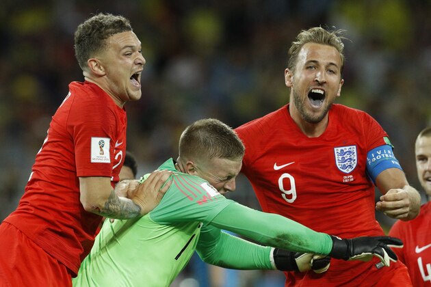England's Harry Kane, right, goalkeeper Jordan Pickford, centre, and Kieran Trippier celebrate at the end of the round of 16 match between Colombia and England at the 2018 soccer World Cup in the Spartak Stadium, in Moscow, Russia, Tuesday, July 3, 2018. England won after a penalty shoot out. (AP Photo/Victor R. Caivano)