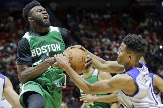 Philadelphia 76ers guard Markelle Fultz (7) defends against Boston Celtics forward Jaylen Brown, left, during the second half of an NBA summer league basketball game Monday, July 3, 2017, in Salt Lake City. (AP Photo/Rick Bowmer)