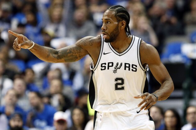 San Antonio Spurs forward Kawhi Leonard (2) celebrates sinking a basket in the first half of an NBA basketball game against the Dallas Mavericks onTuesday, Dec. 12, 2017, in Dallas. (AP Photo/Tony Gutierrez)