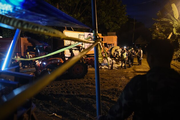 Engineers work around a pumping site at Tham Luang cave area as operations continue for the 12 boys and their coach trapped at the cave at Khun Nam Nang Non Forest Park in the Mae Sai district of Chiang Rai province on July 5, 2018. - Thai rescuers on July 5 said they may be prodded into a complex extraction of 12 boys and their football coach from a flooded cave if forecast rains hammer the mountainside and jeopardise the rescue mission. (Photo by Lillian SUWANRUMPHA / AFP)        (Photo credit should read LILLIAN SUWANRUMPHA/AFP/Getty Images)