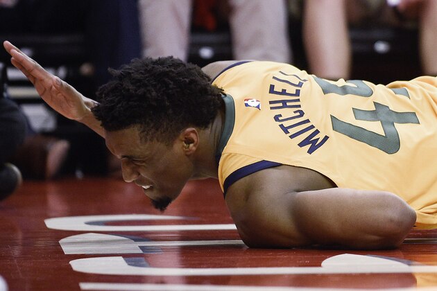 Utah Jazz guard Donovan Mitchell reacts after injuring himself during the second half in Game 1 of an NBA basketball second-round playoff series, Sunday, April 29, 2018, in Houston. Mitchell remained in the game. Houston won 110-96. (AP Photo/Eric Christian Smith)