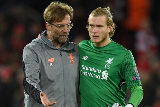 Liverpool's German manager Jurgen Klopp (L) talks with Liverpool's German goalkeeper Loris Karius after winning the UEFA Champions League first leg semi-final football match between Liverpool and Roma at Anfield stadium in Liverpool, north west England on April 24, 2018. (Photo by Oli SCARFF / AFP)        (Photo credit should read OLI SCARFF/AFP/Getty Images)