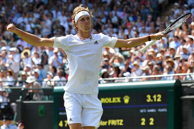Germany's Alexander Zverev celebrates after winning against US player Taylor Fritz during their men's singles second round match on the fifth day of the 2018 Wimbledon Championships at The All England Lawn Tennis Club in Wimbledon, southwest London, on July 6, 2018. - Zverev won the match 6-4, 5-7, 6-7, 6-1, 6-2. (Photo by Ben STANSALL / AFP) / RESTRICTED TO EDITORIAL USE        (Photo credit should read BEN STANSALL/AFP/Getty Images)