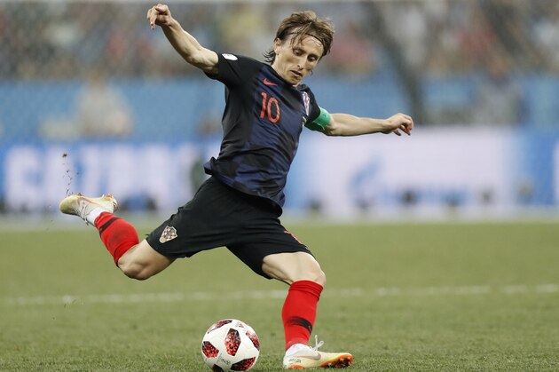 FILE - In this Sunday, July 1, 2018 file photo Croatia's Luka Modric shots on target during the round of 16 match between Croatia and Denmark at the 2018 soccer World Cup in the Nizhny Novgorod Stadium, in Nizhny Novgorod , Russia. (AP Photo/Efrem Lukatsky, File)